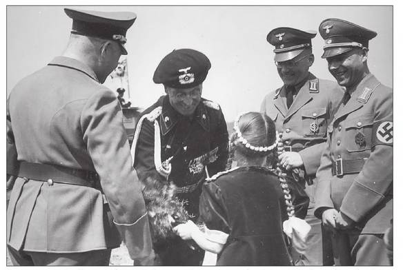 A young girl from Vaihingen gives a bouquet of flowers to Oberst Landgraf, before the eyes of the Bürgermeister Heller and the Kreisleister and Ortsgruppenleister Junginger ......................................