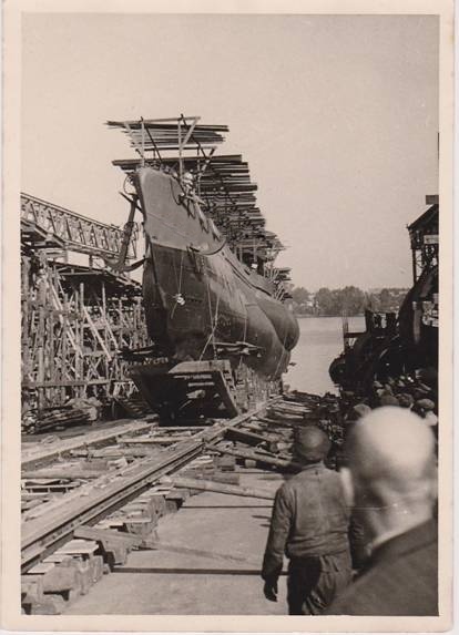 Interesting image of a U Boat Type VII C during her launching; note the slipway, the rails where it slides and a camouflage structure on the deck ........................