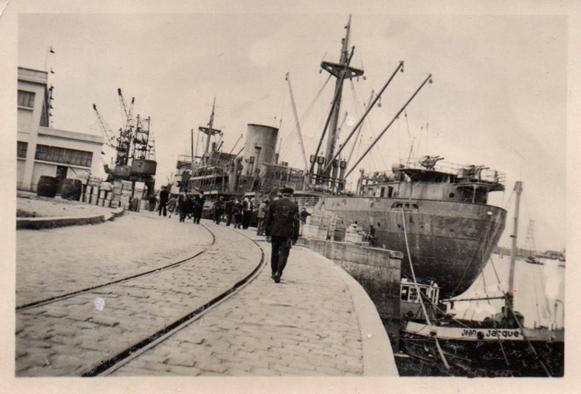 View of one of the docks in a occupied French port; the ship carries two guns aft (a corsair ??) .........................
