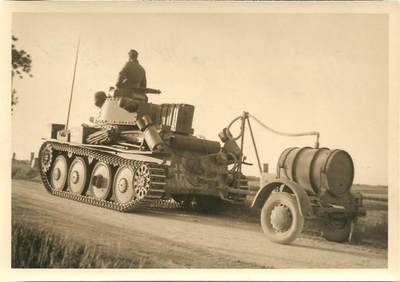 A Pz Kw 38 (t) with its trailer on the move.............................................