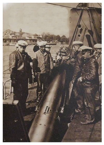 Loading a torpedo into a U boat Type IA  (it seems) ..............................