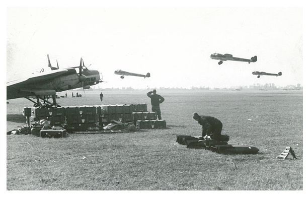 Ground crew preparing material for another mission, while a kette (three aircrafts) of Do-17 takes off  .......................................................