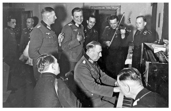 Schmidt at the piano in his farewell party in Oriol, March 4, 1943...............