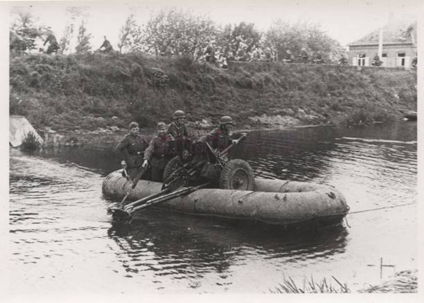German infantry of the 19. ID crossing an anti-tank weapon 3.7 cm Pak in a pneumatic boat through the Albert Canal - May 1940 .................