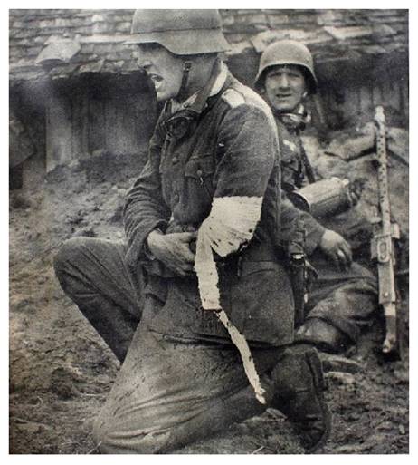 The German officer, although wounded, continues to give orders calmly and clearly ......................