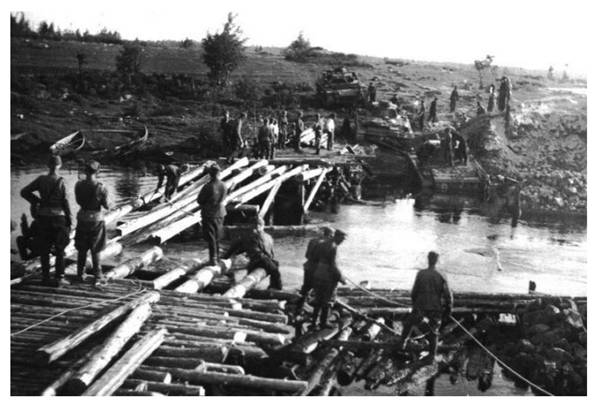 Finnish sappers working on the bridge over the Vuonnisenjoki; on the opposite bank three Pz Kw III of the 3. / Pz Abt. 40 ..............