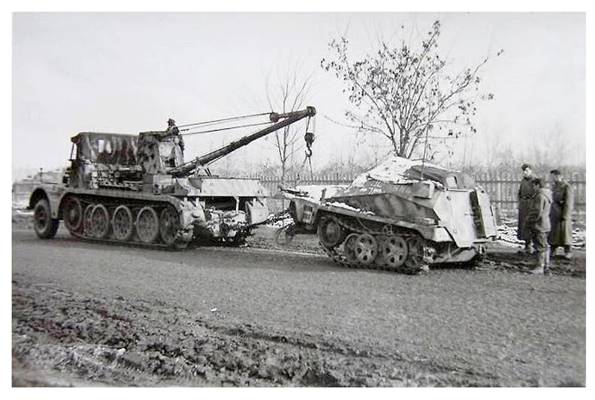 A Schwerer Zugkraftwagen 18 t, Sd.Kfz. 9/1 with a 6 t capacity crane retrieving a Sd Kfz 250 (apparently).........................