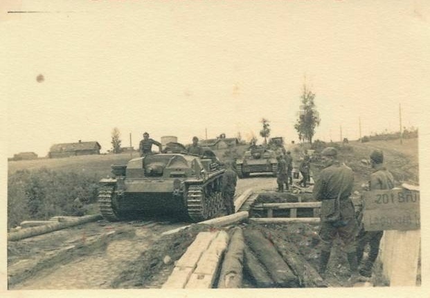 A column of assault guns (StuG III Ausf. B) overcomes a stream on a bridge built by the sappers........................