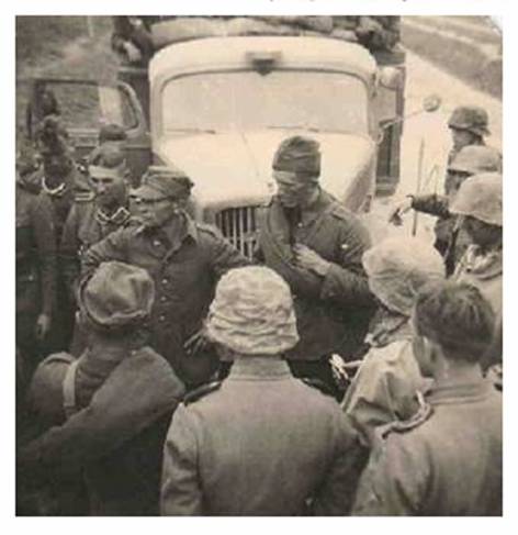 Polish prisoners with SS troops ..........................................