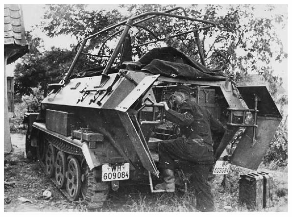 Rear view of a Sd. Kfz. 251/6 mittlere Kommandopanzerwagen with its tailgates open............................