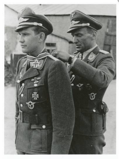 Moment in which Hans Ulrich Rudel awarded the Knight's Cross to Leutnant Helmut Fickel.......