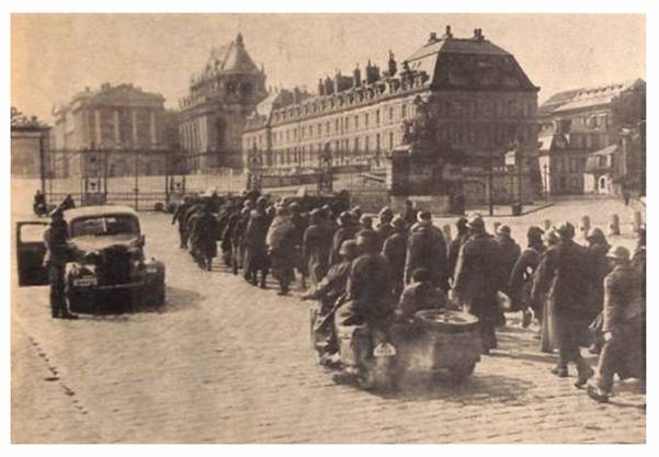 A column of French soldiers escorted into captivity, with the Palace of Versailles in the background?........