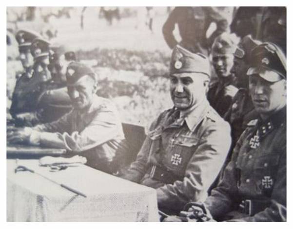 In the photo SS-Sturmbannführer Meyer accompanied (as far as I know) by the Romanian General Ioan Mihail Racoviță, Commander of the Cavalry Corps at that time....................