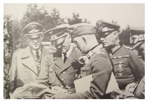 The Führer updating himself on the situation, from the left Rommel, ??, AH, ??, Keitel and ??........................
