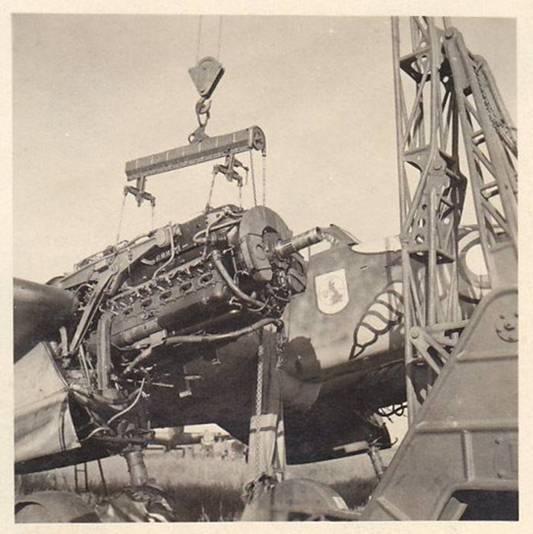 Bf-110 G-2 of the 1./ZG1 during engine change in Ledna in the summer of 1943. On the fuselage nose the coat of arms of the ZG1 and that of the I./SKG210..................