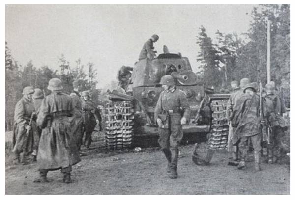 German soldiers examine a disabled Soviet KV-1 heavy tank - Barbarossa 1941..................