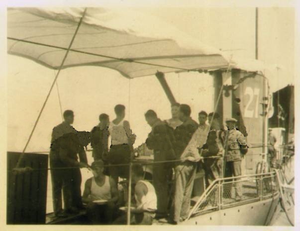 U 27, Type VII A, (with the Handelsflagge) in a Spanish port, part of the crew can be seen relaxed under the awning...............