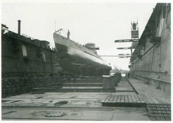 A German U-boat Type IX B, U 103, in dry dock after a patrol......................