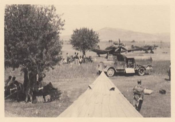 Staffel of Junkers Ju-87 &quot;Stuka&quot; deployed at one airfield in the Mediterranean; in the foreground a tent and then a tanker truck.................................