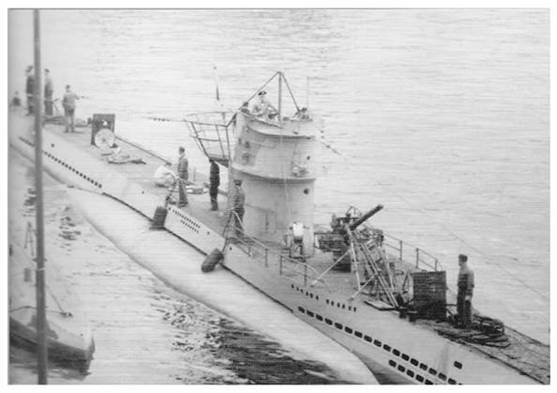 U 74 setting up all the paraphernalia(*) to receive torpedoes on board..................