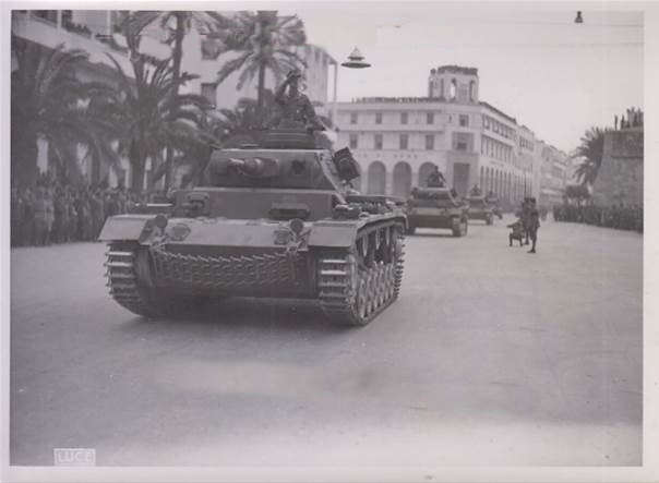 Column of Pz Kw III Ausf. G parade down the main street...............................