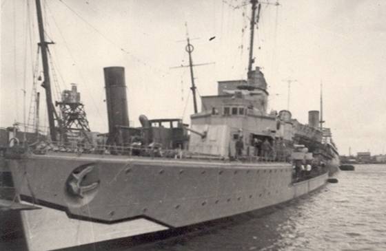 Torpedo ship at wharf.