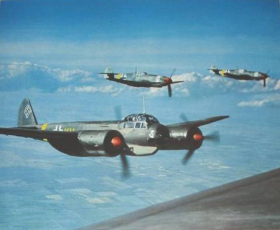 Two Me-109 escorting some Ju-88.