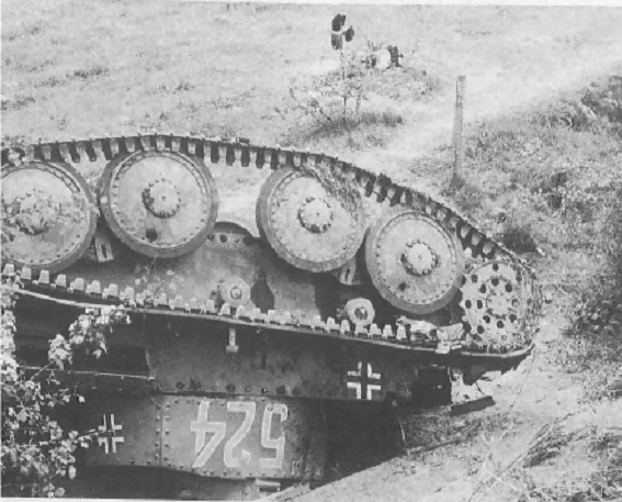 A Pz Kw 38 (t)? stayed up side down somewhere in France; behind the grave of one of its crew (accident or enemy's action?).