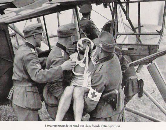 A mountain hunter, seriously wounded, being evacuated in a Fi-156..................