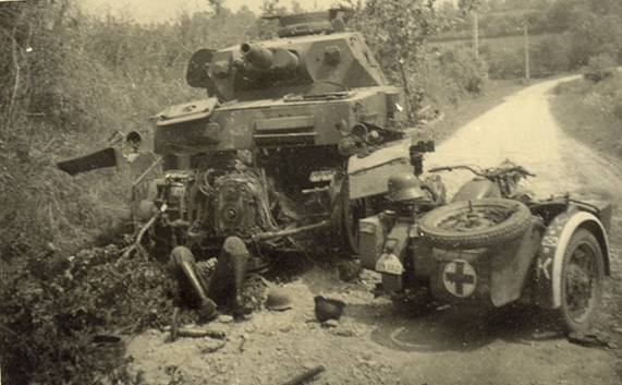 A knocked out Pz Kw IV and a German casualty - 2 Pz in France 1940.