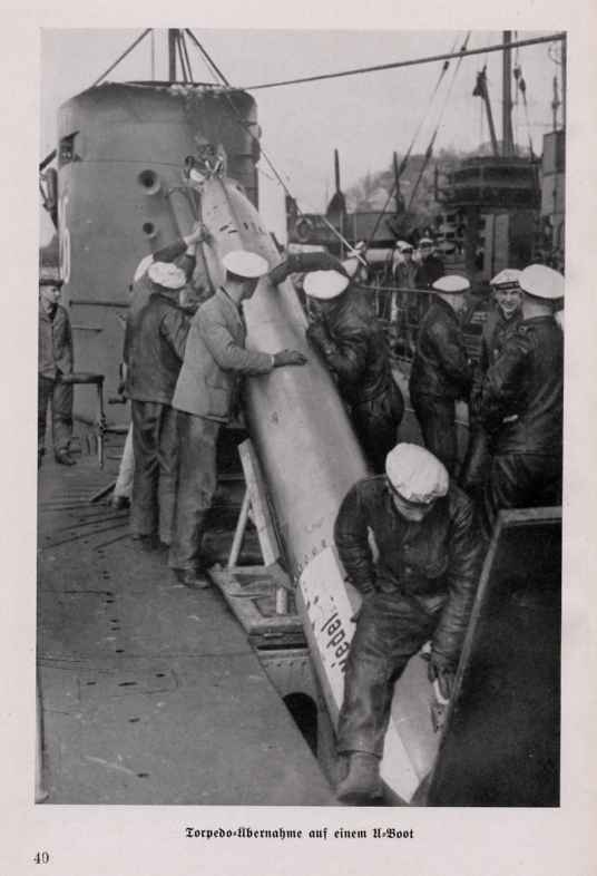 Loading a torpedo in a submarine (U-25).