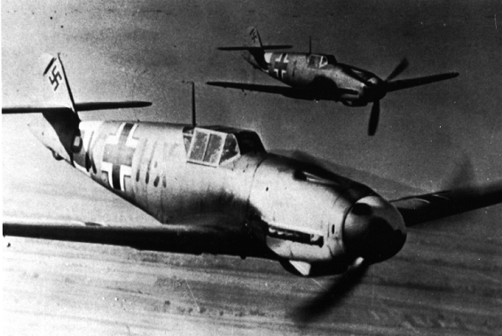 A pair of Bf-109 F in a training flight; see the ID PK+HX. A Lehr Staffel?..................