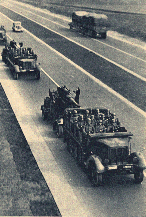 An anti-aircraft unit in movement by a German motorway (Seen here an Sd Kfz 7 prime mover and its 88 mm).