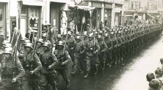Troops of GJR 100 marching through Salzburg - March 1938.