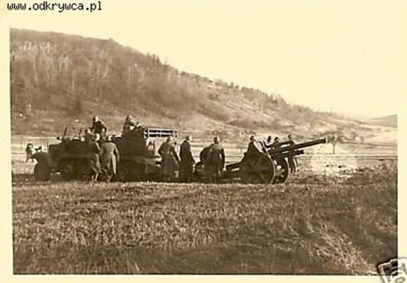 A howitzer le. FH 18 towed by a Sd Kfz 6 enters in position during the fighting around Bochnia................