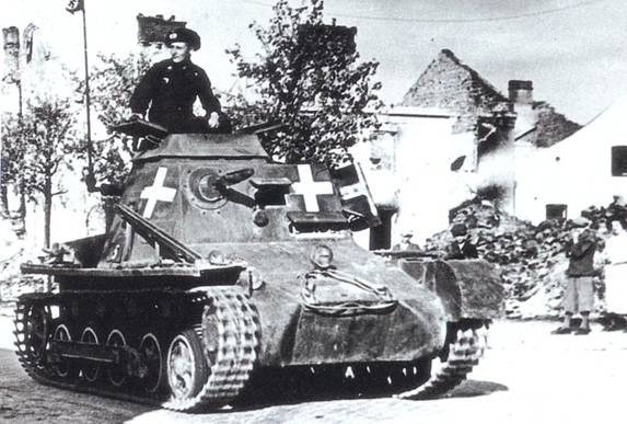 A little command tank (Panzerbefehl) rolling through a Polish town.......................