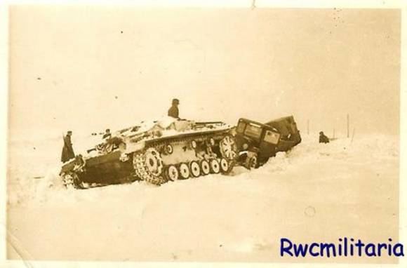 In the snow, towed by a Stug III........................