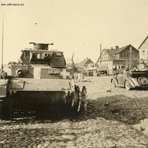 A  Pz Kw IV destroyed in a Polish town........................