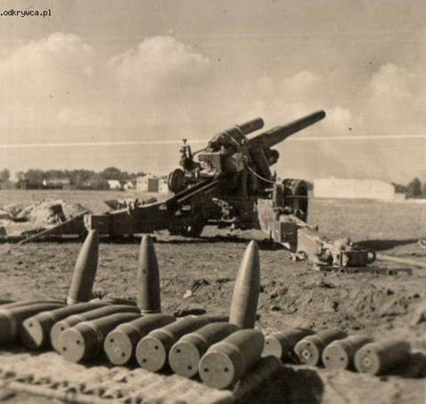 Amazing view of the howitzer and its ammunition in foreground .....................