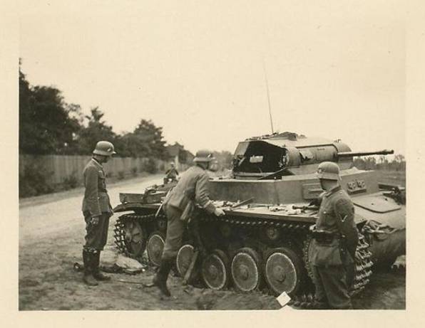 German soldiers examining a Pz Kw II destroyed by enemy action ......................<br /> http://odkrywca.pl/panzer39-wraki-czesc-trzecia,559785.html#559785