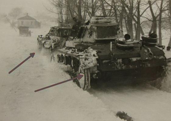 A Pz Kw III towing another Pz Kw III which has lost one of the caterpillars .................