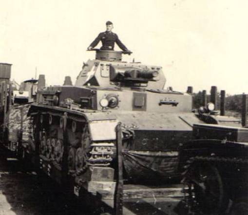 A Pz Kw IV Ausf. A (among other armored vehicles) being transported by rail ......................
