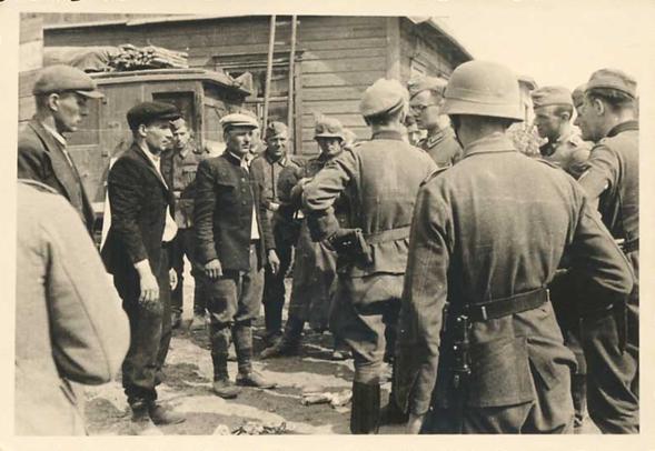 Civilians being questioned by German soldiers during the advance by the Baltic states in June 1941 .................