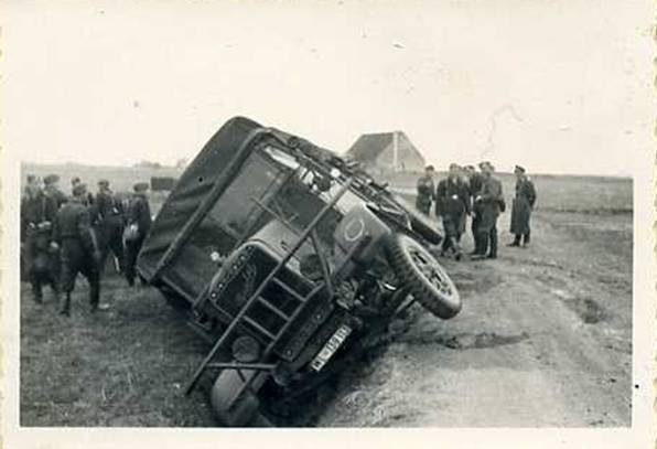 A Henschel? truck carrying ammunition for a Flak unit in the ditch .....................................