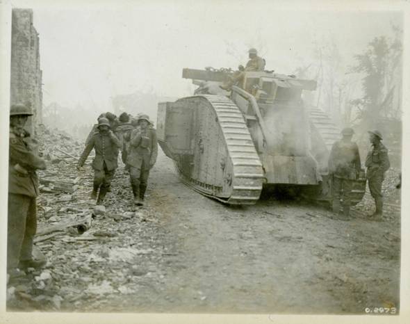 Traffic on the Amiens-Roye Road. German prisoners carry Canadian wounded soldier to the rear..........................<br />http://www.warmuseum.ca/firstworldwar/objects-and-photos/photographs/battles-and-fighting-photographs/traffic-on-the-amiens-roye-road/?back=158