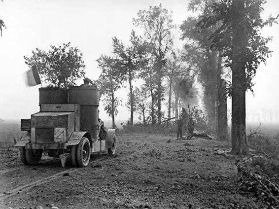 An armoured car, carrying a French flag, moving toward Péronne east of Lamotte–Warfusée, France, 8 August 1918................................