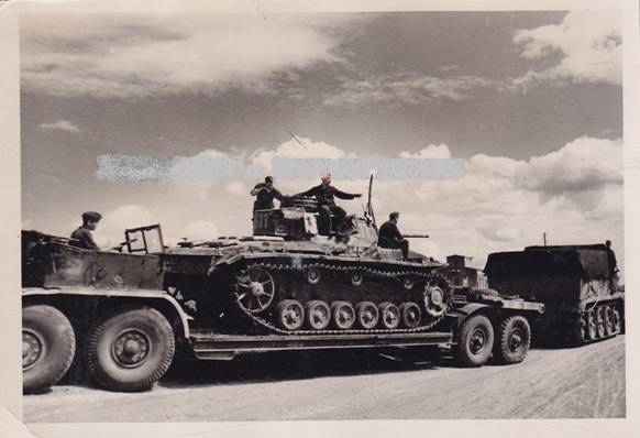 A Zugkraftwagen towing a Sd. Ah. 116 carrying a Pz Kw III Langrohr (Ausf.J?) ..................................
