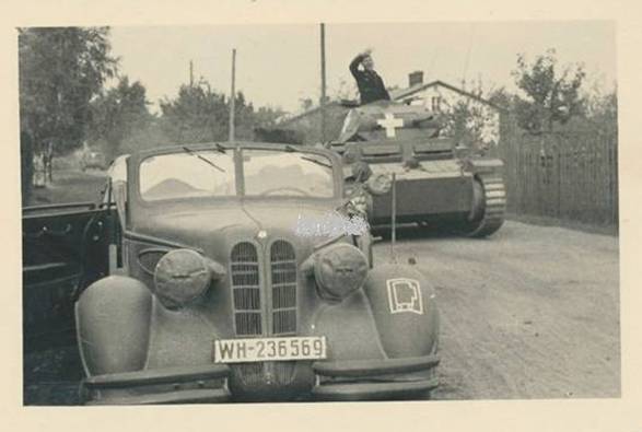 In the foreground a PKW BMW 326 and behind a Pz Kw II Ausf. D/E of a light division in some Polish road ....................................... ...<br /> http://odkrywca.pl/panzer-1939-czesc-14,721701.html