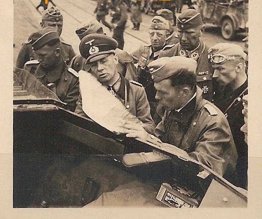 Erwin Rommel and other officers looking at a situation map somewhere in the front..................