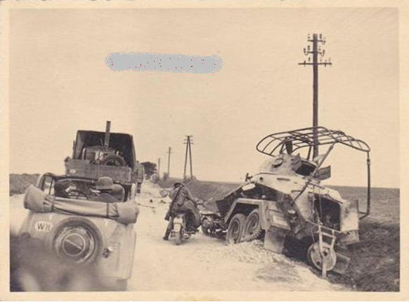 View of a Funkwagen Sd Kfz 232 (6-rad) put out of action by enemy action at the side of a Polish road..............................